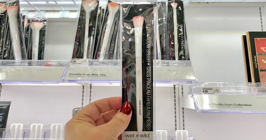 hand holding up a wet n wild Eyeshadow Brush in store