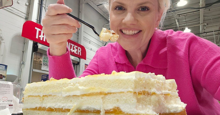 woman smiling while eating Peaches and Cream cake at Costco