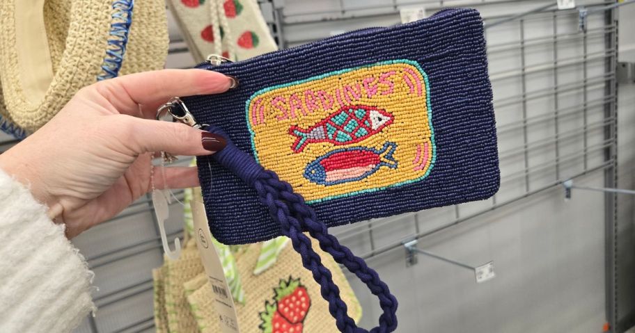 hand holding sardine wristlet at the store
