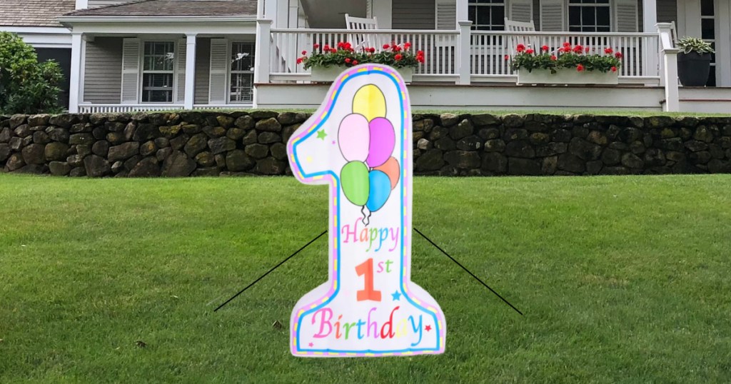 Lighted first birthday, inflatable on grass in front of home