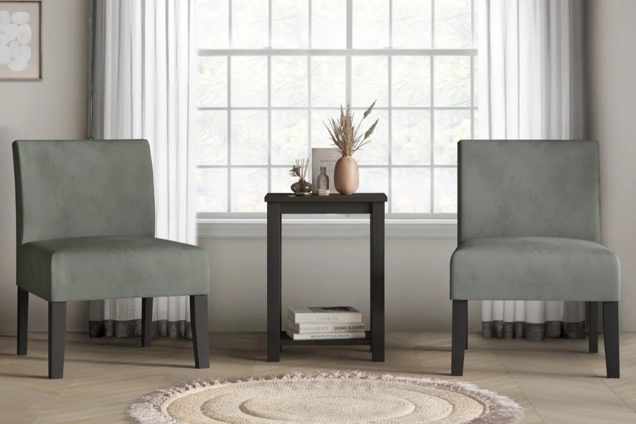 two slipper chairs and an end table