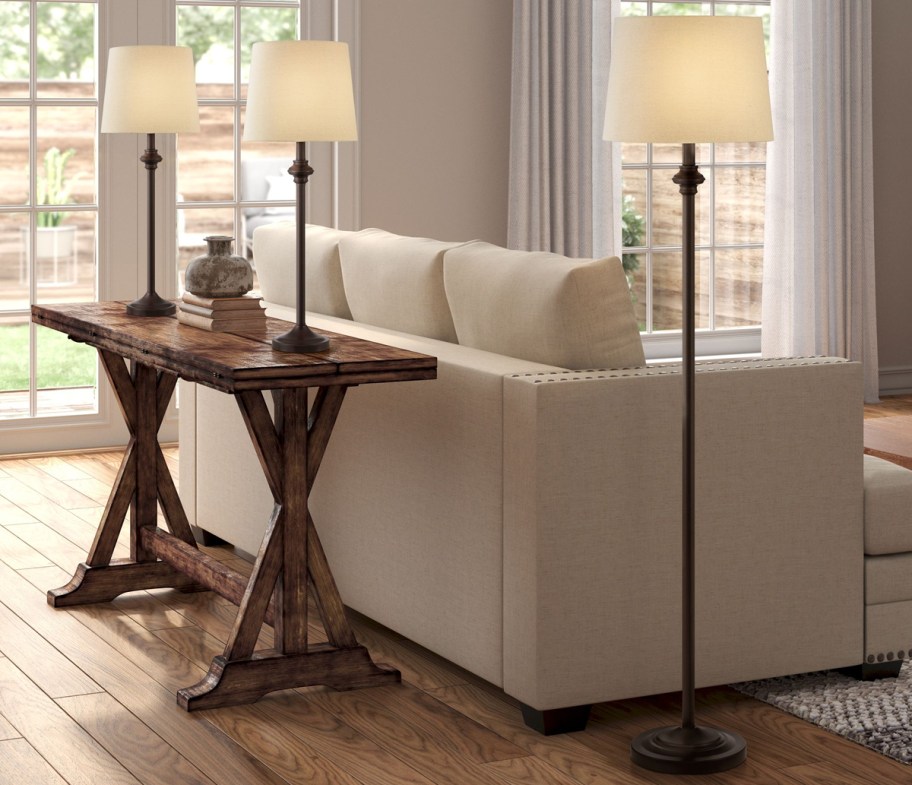 two matching table lamps and a floor lamp in a living room