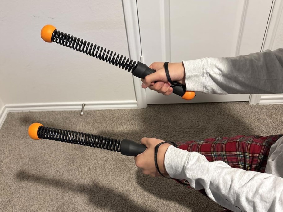 person holding cordless battle ropes