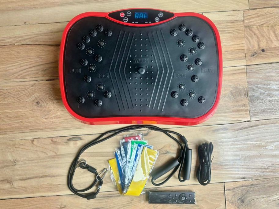 ALSO GO Vibration Plate Exercise Machine in Black with accessories on floor