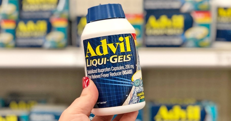 hand holding a bottle of Advil Liqui-Gels in store