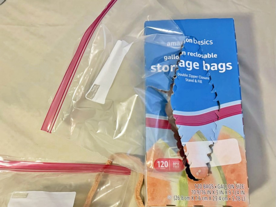 blue box of Amazon Basics Gallon Food Storage Bags with bag coming out from the box