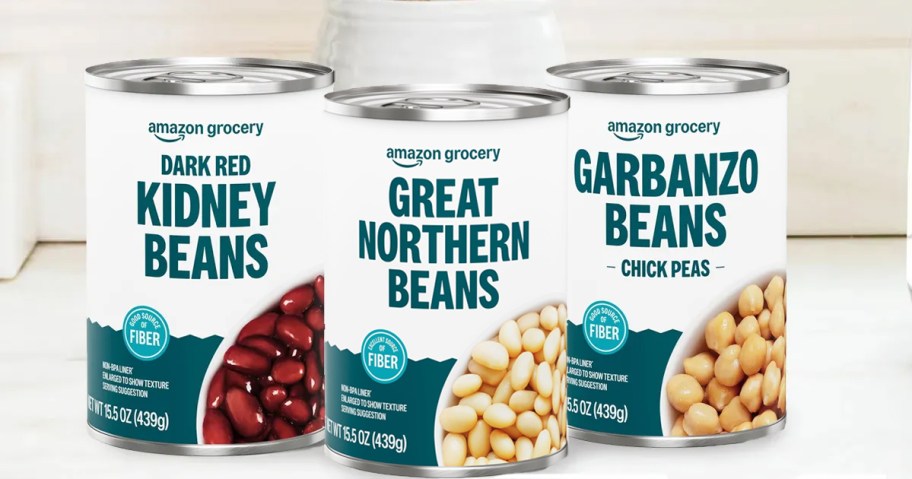 three cans of Amazon Grocery canned beans on counter