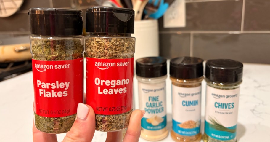 Hand holding up Amazon spices