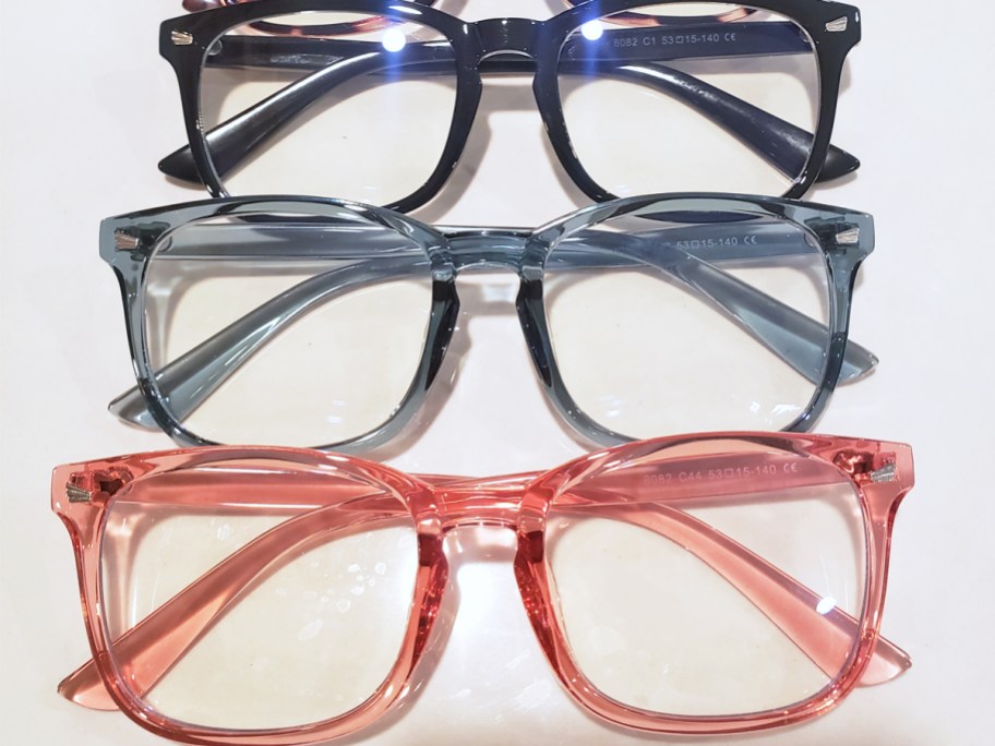 3 pairs of glasses in a row on a white table