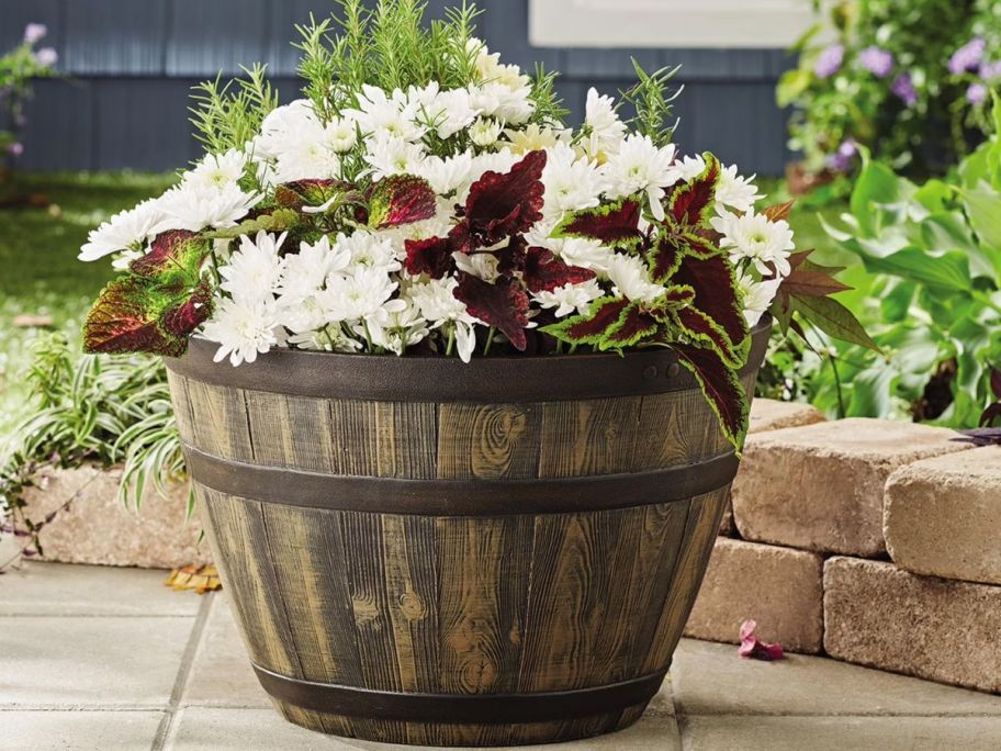 Better Homes & Gardens 16" Whiskey Barrel Recycled Resin Planter on patio