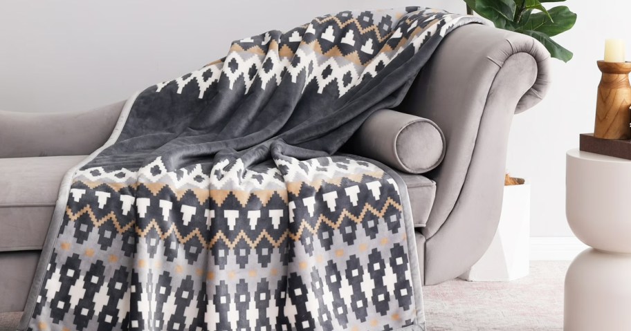 grey throw blanket draped over a couch