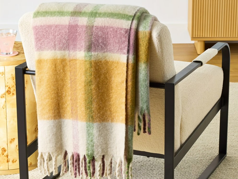 plaid throw draped over an accent chair