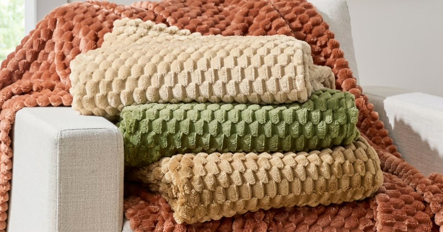 stack of folded throw blankets