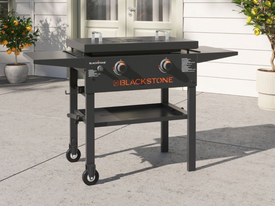 Blackstone 28" w/ Hard Cover 2 -Burner Liquid Propane Flat Top Grill on patio