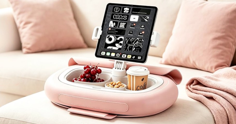 tablet held up by a pillow tablet stand on a couch