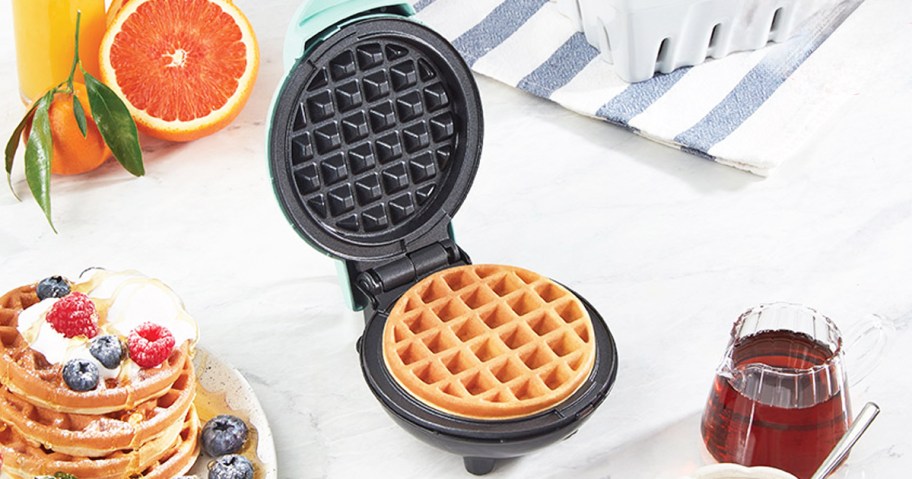 making a waffle on a mini waffle maker