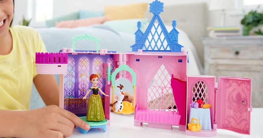 kid playing with Disney Frozen Storytime Stackers Playset