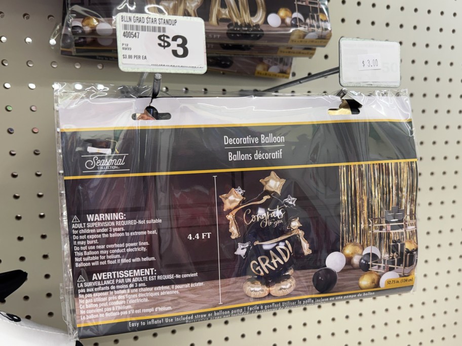 stand-up graduation balloon on store display wall