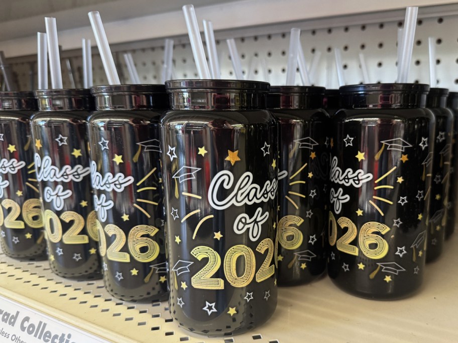 black and gold graduation sipper bottles on store shelf