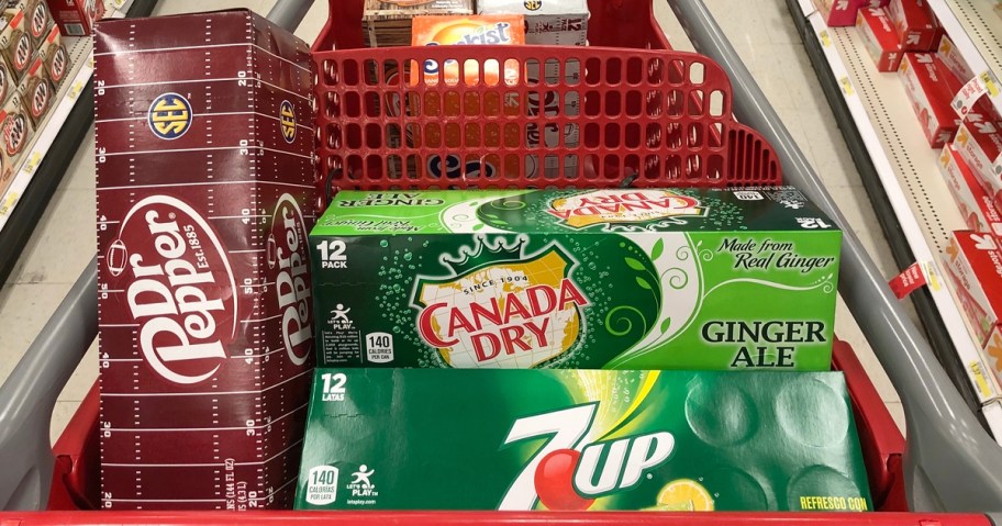 Dr Pepper, Canada Dry, and 7UP soda cases in a red shopping cart