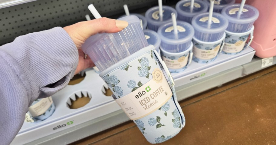 hand holding a blue hydrangea print tumbler in store