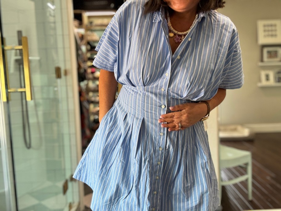 woman wearing blue shirtdress
