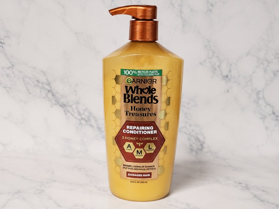 large bottle of Garnier Whole Blends Honey Treasures Conditioner