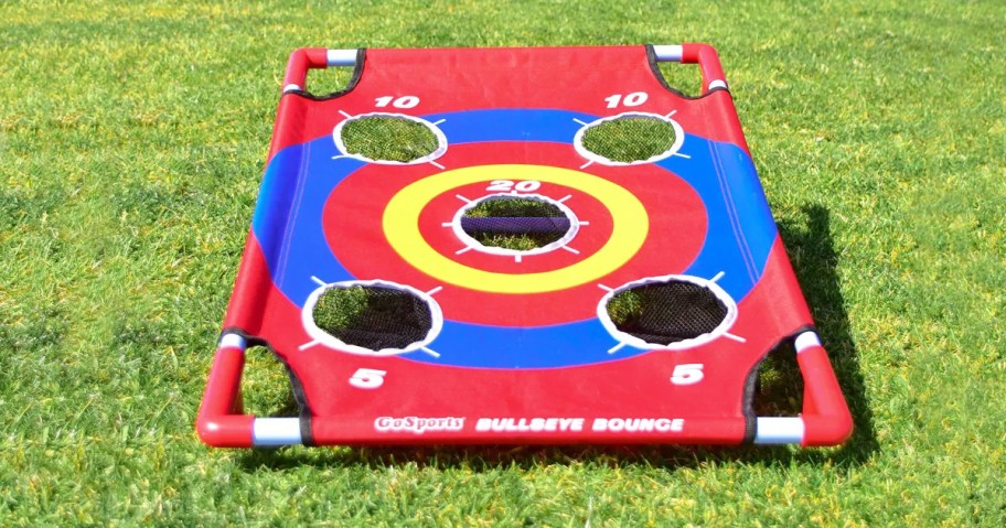 red and blue cornhole set on grass
