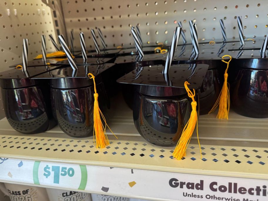Graduation Hat Shaped Canteen With Straw on shelf in store