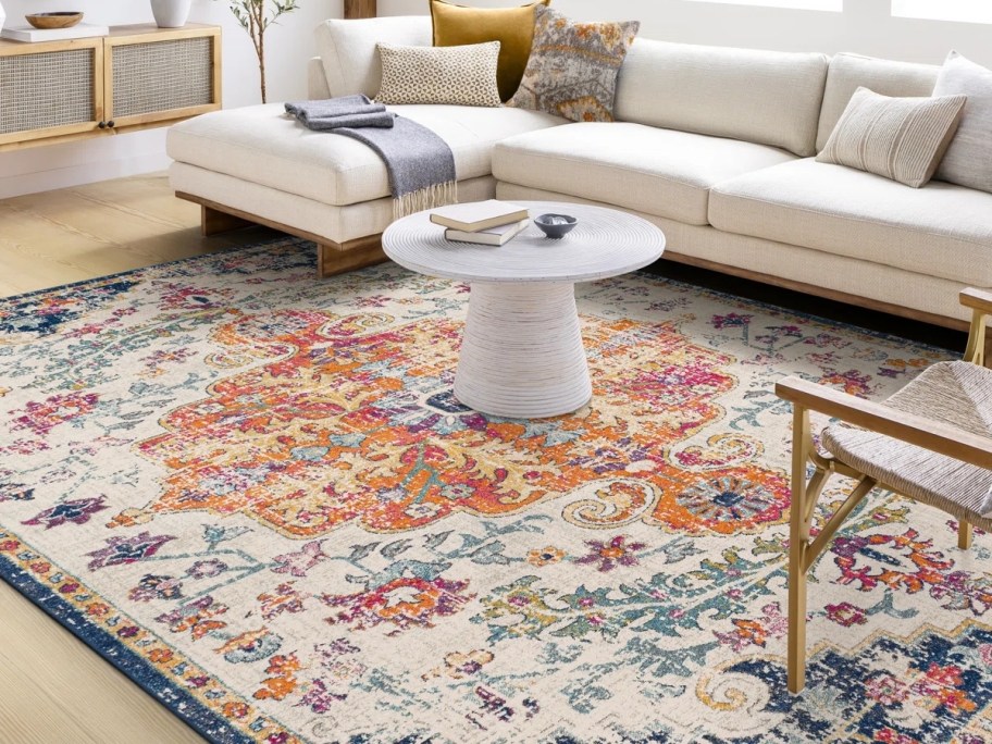 an oriental rug in brught blue, orange, yellow and white