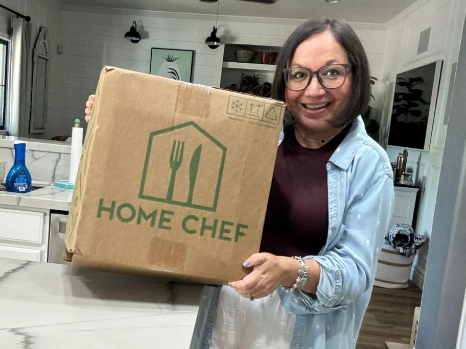 woman holding a home chef delivery box