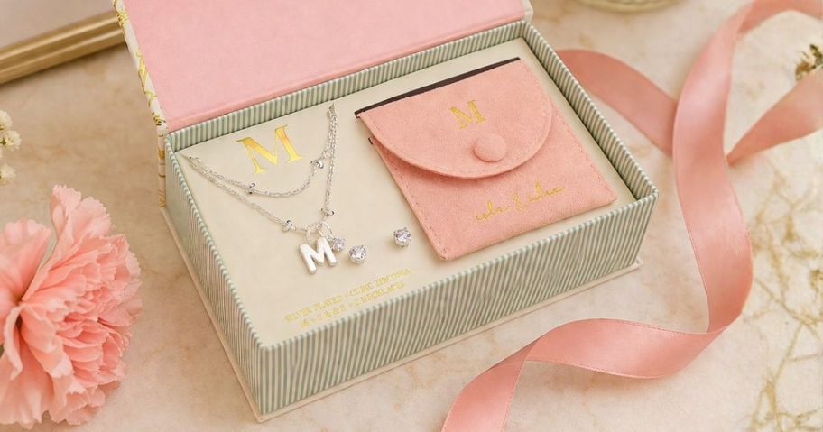 Isla & Alex Fine Silver Plated CZ Initial Pendant Necklace & Earrings Set on table