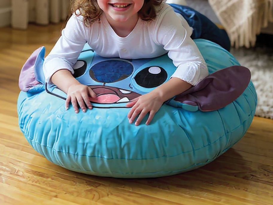 kid laying on stitch Jay Franco Licensed Character Floor Cushion