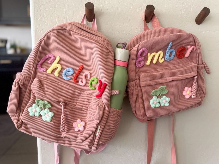 KEQHAULI Custom Corduroy Backpacks hanging on wall