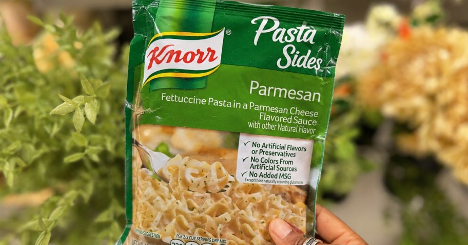 hand holding up a pack of knorr pasta sides