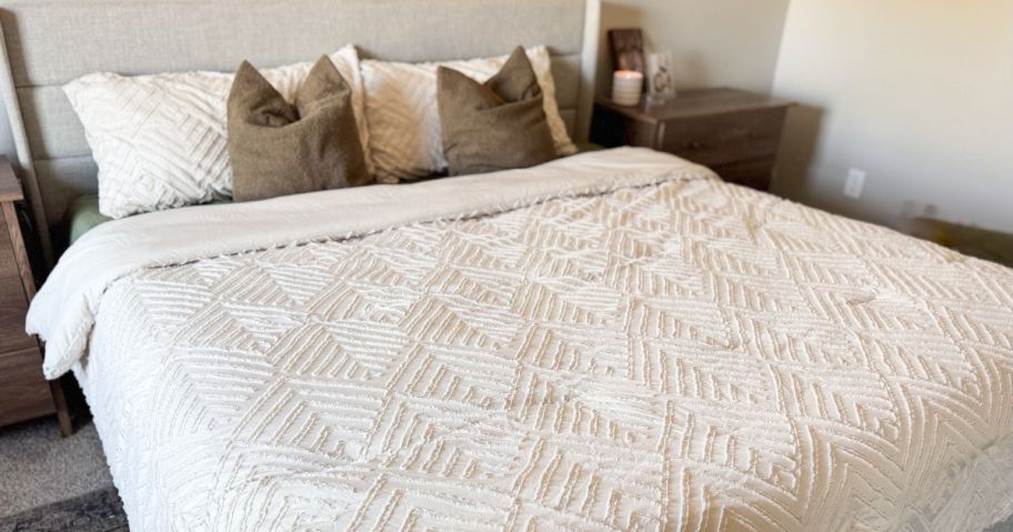A bed with a Litanika comforter set