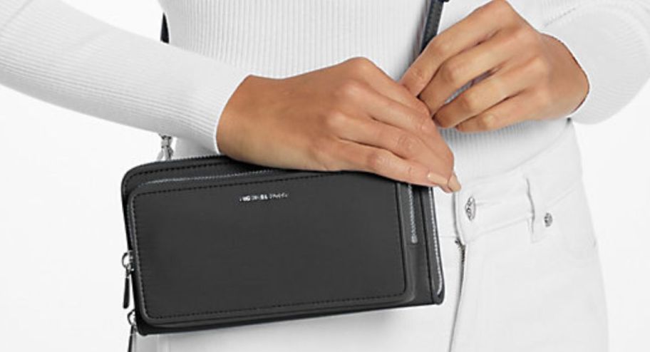 Woman holding Michael kors bags