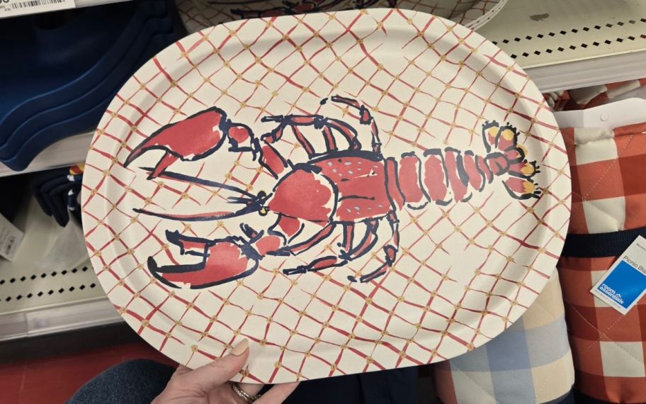 Room Essentials hand holding Nautical plate with lobster