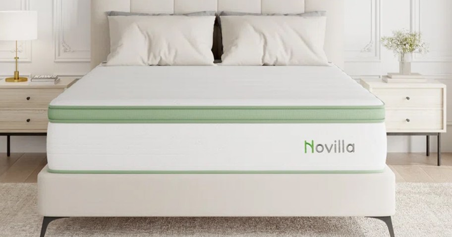 white and green mattress on an upholstered bed frame