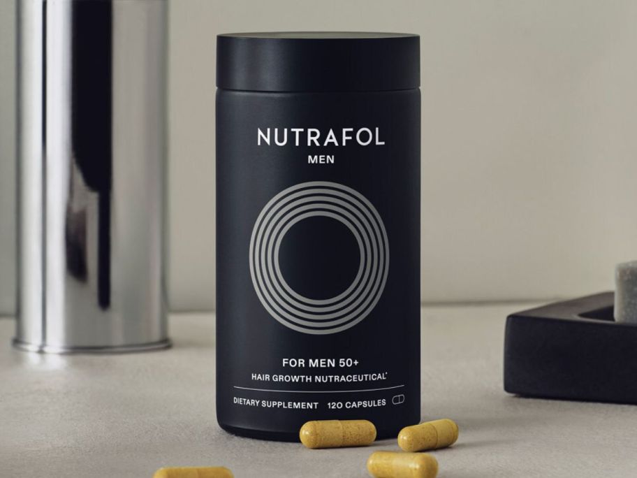 Nutrafol Men Hair Growth Nutraceutical Supplement bottle on counter