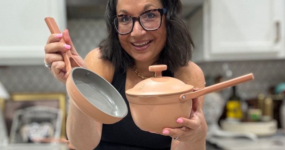 woman holding an Our Place Tinies cookware set