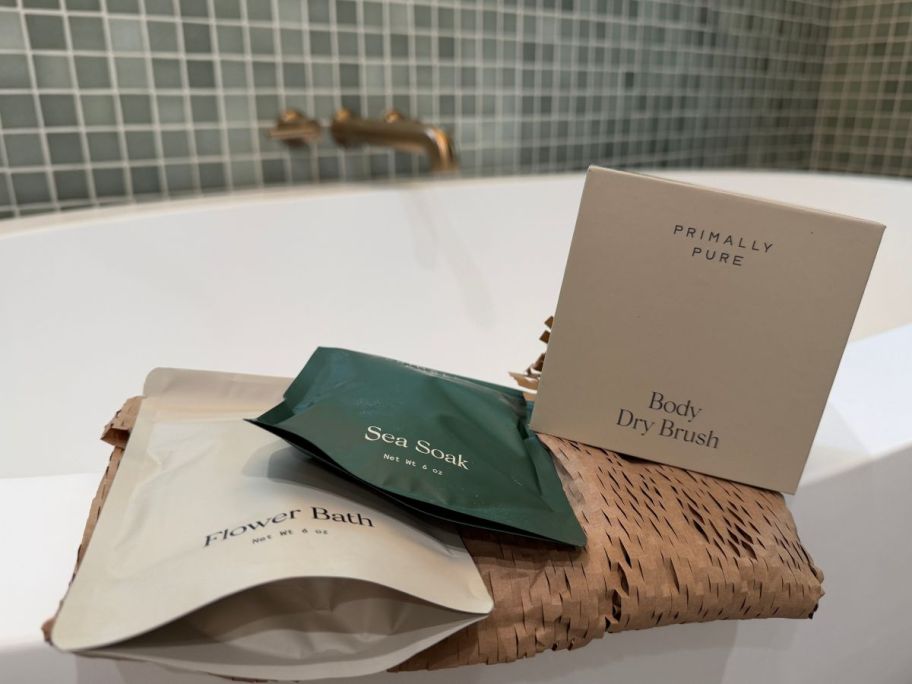 Primally Pure The Spa Kit on ledge of bathtub