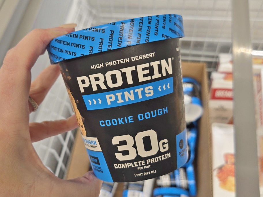 hand holding Protein Pints Cookie Dough Ice Cream in store