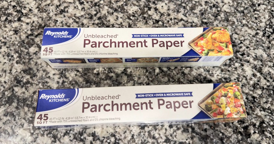 two rolls of Reynolds Kitchens Unbleached Parchment Paper on kitchen counter