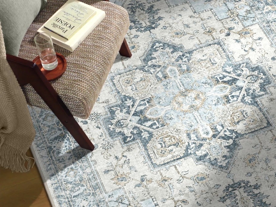 an oriental rug in shades of blue gray and tan