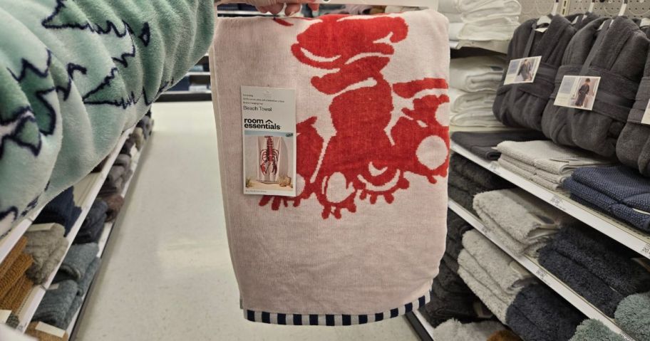 Room Essentials Lobster Oversized Beach Towel in hand in store