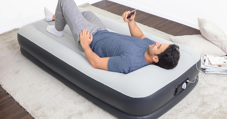 man laying on an inflatable mattress
