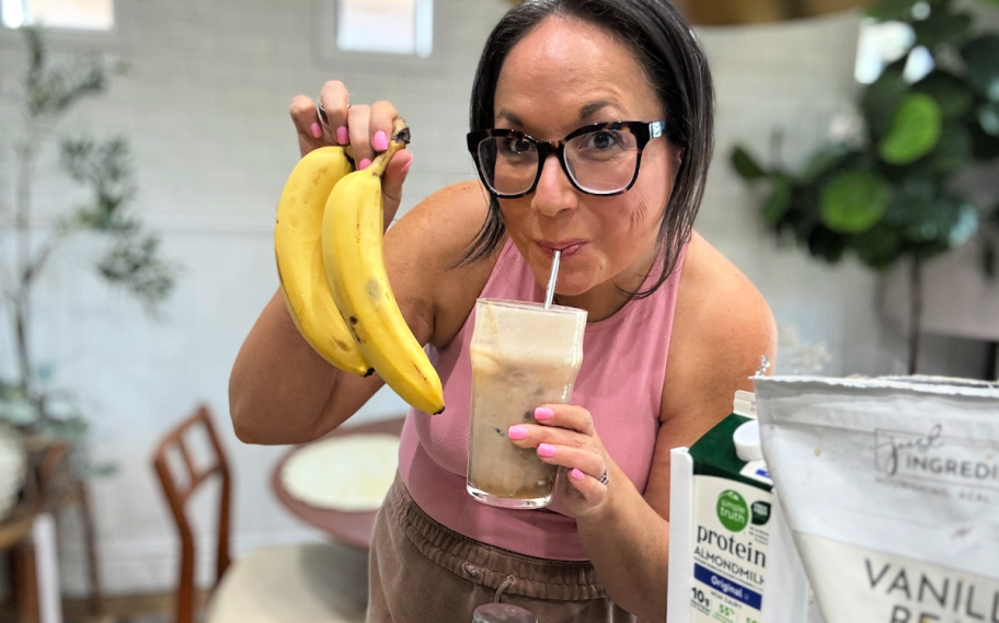 woman drinking a protein banana latte 