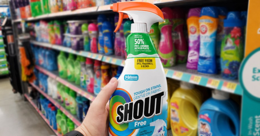 hand holding a bottle of Shout Free Stain Remover Spray in laundry aisle