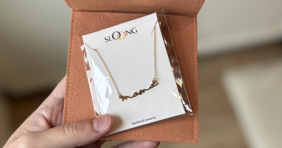sloong mama necklace in packaging with brown leather pouch